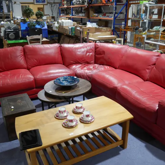 Red leather corner lounge suite