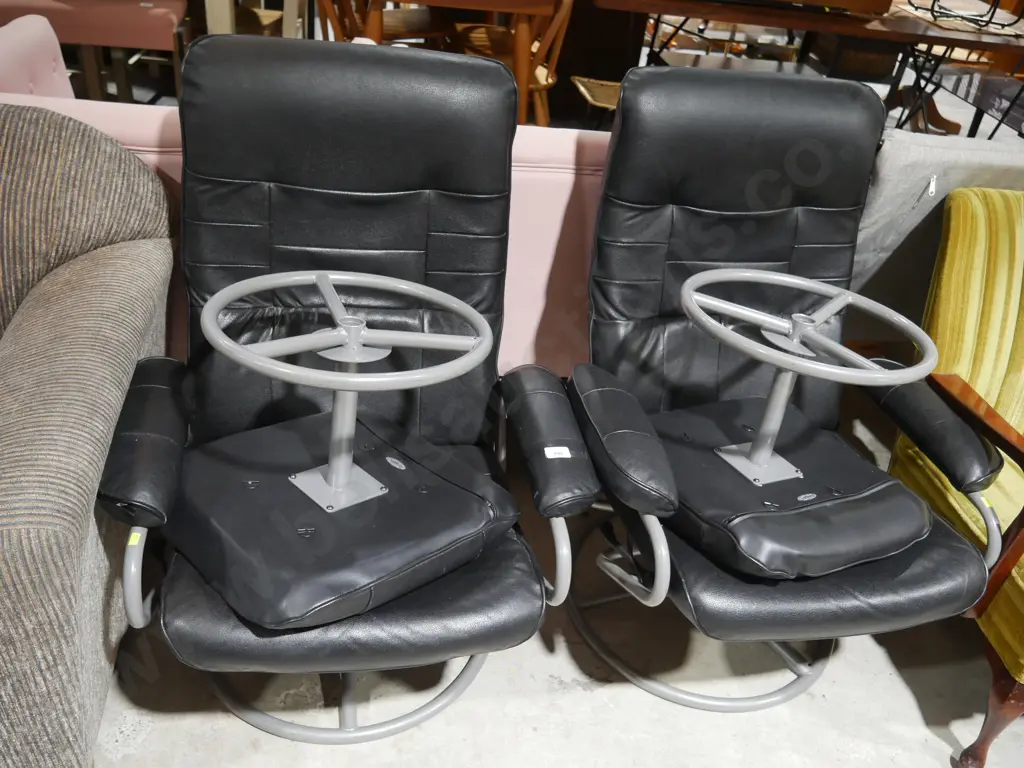 Two black leather chairs with stools Image 1++