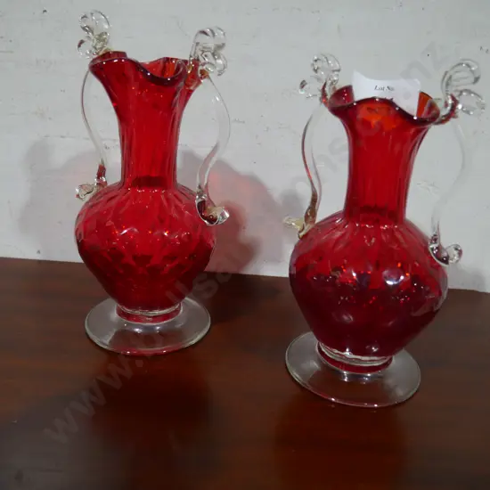 2 red glass vases