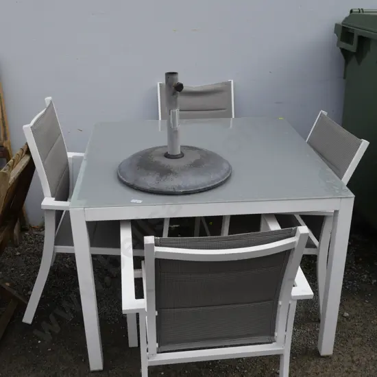 Glass top outdoor table, four chairs and umbrella stand