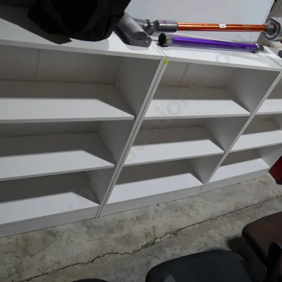 Three white bookcases