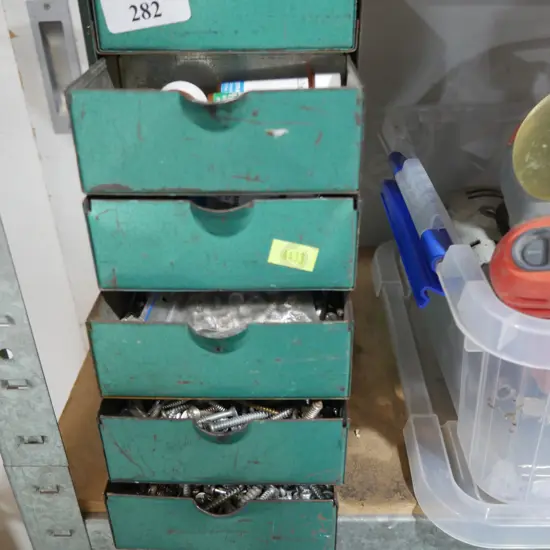 Metal drawer full of screws