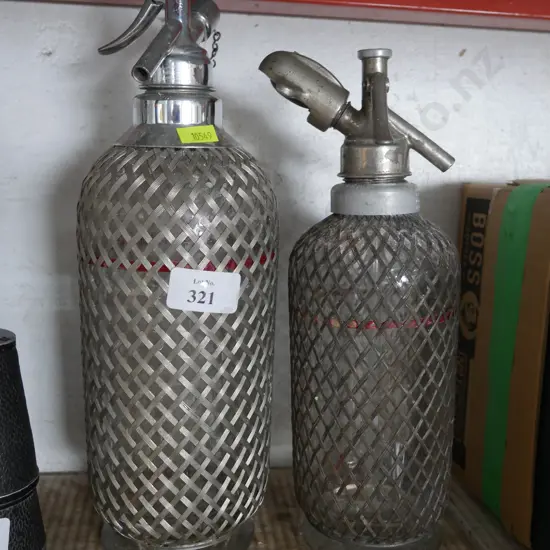 Two soda siphons