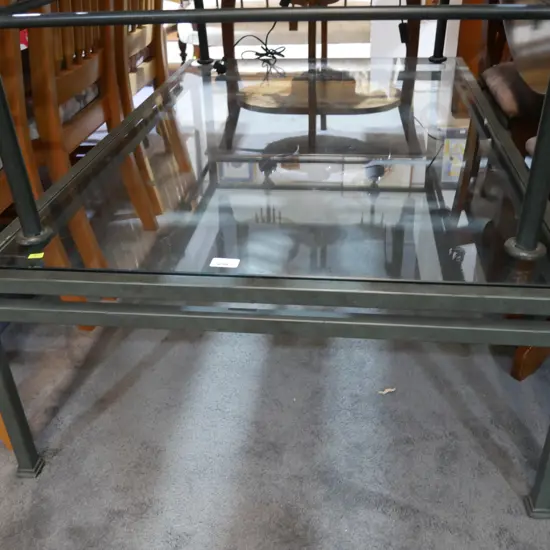 Metal base glass top coffee table