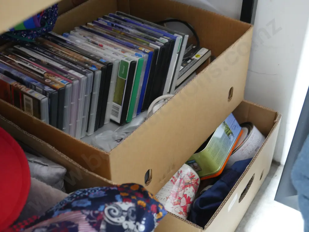 2 boxes of Dvds, tins etc Image 1++