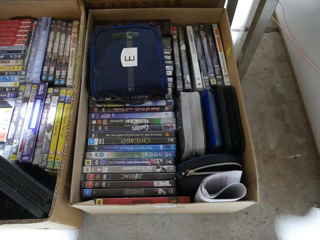 2 boxes of dvds Image 1++