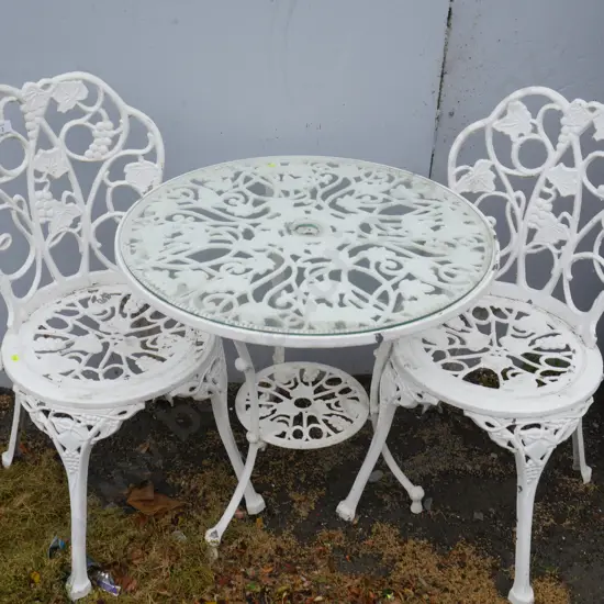 White metal table and two chairs