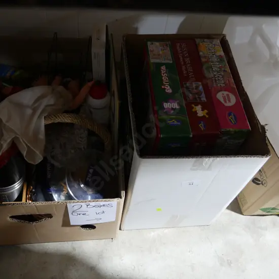 Two boxes of jigsaw puzzles, dolls etc