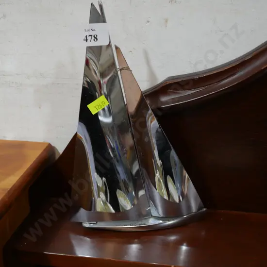 Chrome sailboat sculpture