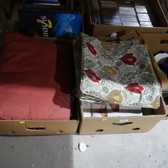 Two boxes of linen and magazines