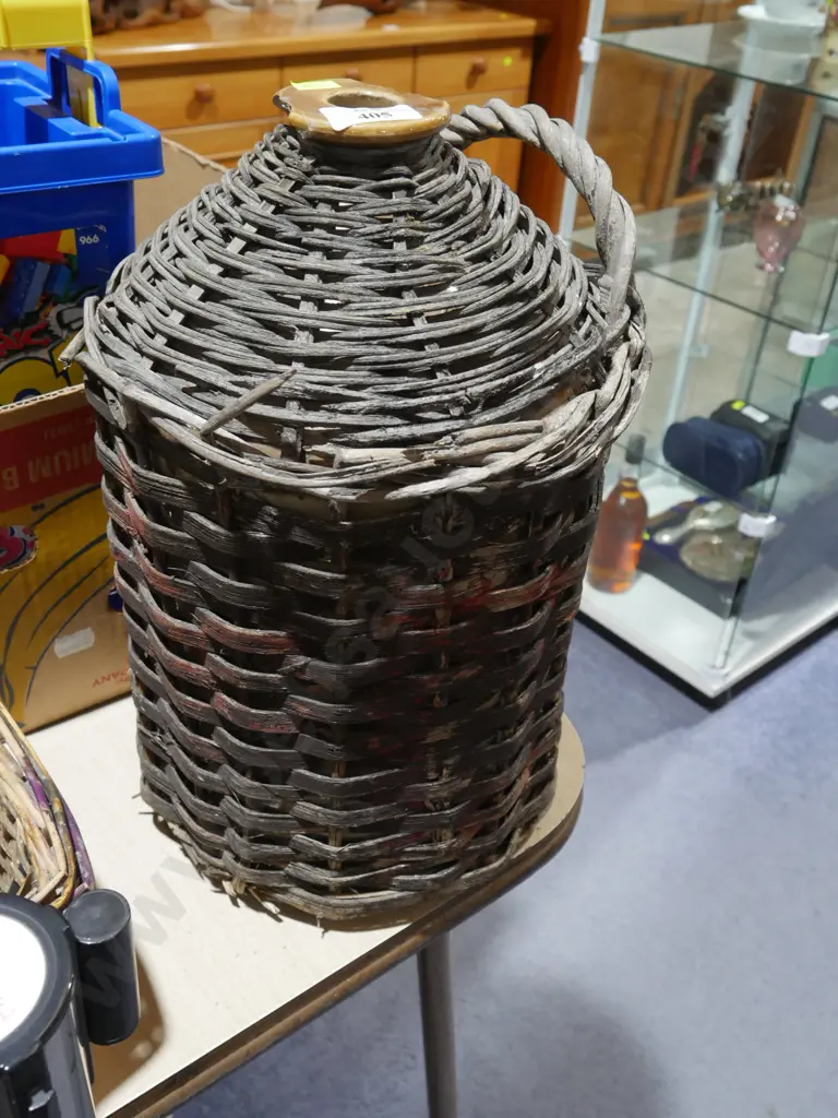 Cane covered stone bottle Image 1++