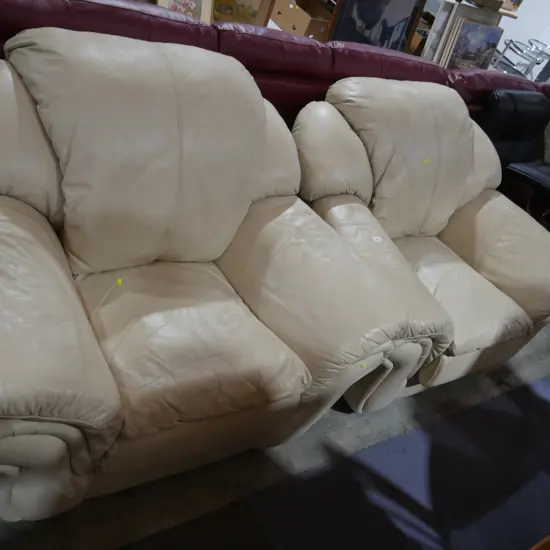 Pair of cream leather armchairs